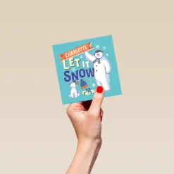 Pod Personalised Kids Blue The Snowman™ & Snowdog Christmas Card -Pod Shop F3007497 hand S